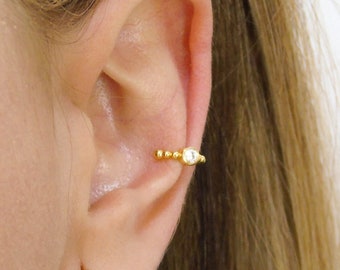 Dainty cz beaded ear cuff earrings. Available in White, Black, Turquoise, Ruby, Emerald, Amenthyst and Blue.