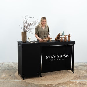 SET Vienna: Portable counter VC-06-w-bl and table VC-04-c-w-bl table in black color, checkout stand, tasting station