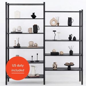 May include: Black metal shelving unit displaying a collection of decorative items. The shelves feature vases, jars, candles, and diffusers in neutral colours. The design is minimalist and modern, ideal for home decor.