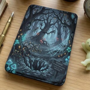 May include: A dark, rectangular case featuring a spooky forest scene with gnarled trees, glowing mushrooms, and a spiderweb. The text on the sign reads "Beware: The Whispering Woods - Enter at Your Own Peril."