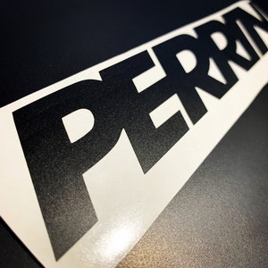 May include: Black and white vinyl sticker with the word "PERRIN" in bold, block letters.