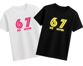 May include: Two short-sleeved t-shirts, one white and one black. Each shirt displays the number "67" in a bold font, with the words "SIX SEVEN" underneath. The white shirt has pink text, while the black shirt has yellow text.