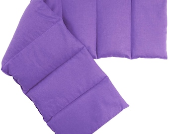 May include: Purple fabric neck wrap with multiple compartments. The wrap is designed to be used as a heating pad.