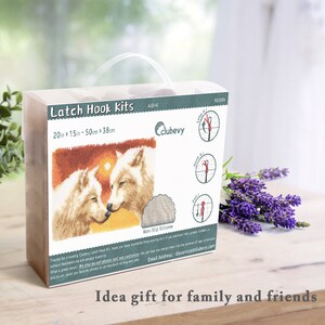 May include: Latch hook kit with a colorful image of two white wolves against a sunset backdrop. The kit includes a 20-inch by 15-inch canvas, non-slip silicone, and instructions. The box is labeled "Latch Hook Kits" and "clubevy".