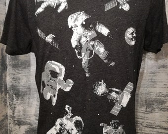 Astronauts in space on charcoal grey mens t shirt