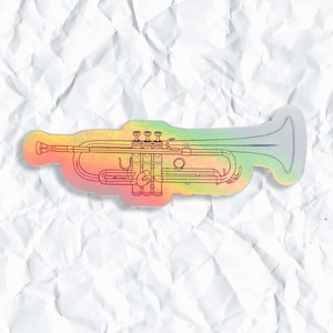 May include: A rainbow holographic sticker of a trumpet. The trumpet is outlined in black and has a silver bell.