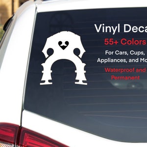 May include: White vinyl decal of a double bass f-hole with the text "Vinyl Decal", "55+ Colors", "For Cars, Cups, Appliances, and More", "Waterproof and Permanent".