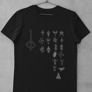 May include: Black t-shirt with a white graphic of a symbol and a series of other symbols.