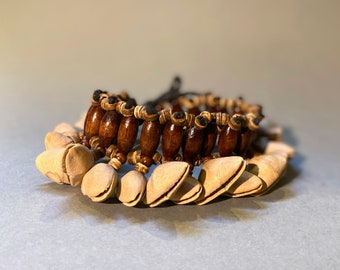 Kenari seed bracelet with strings. A gift for followers of the traditional rituals.