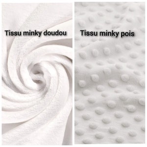 May include: Two close-up images of white minky fabric. The first image shows a smooth, plush fabric. The second image shows a textured fabric with small, raised dots. The text "Tissu minky doudou" is above the first image and "Tissu minky pois" is above the second image.