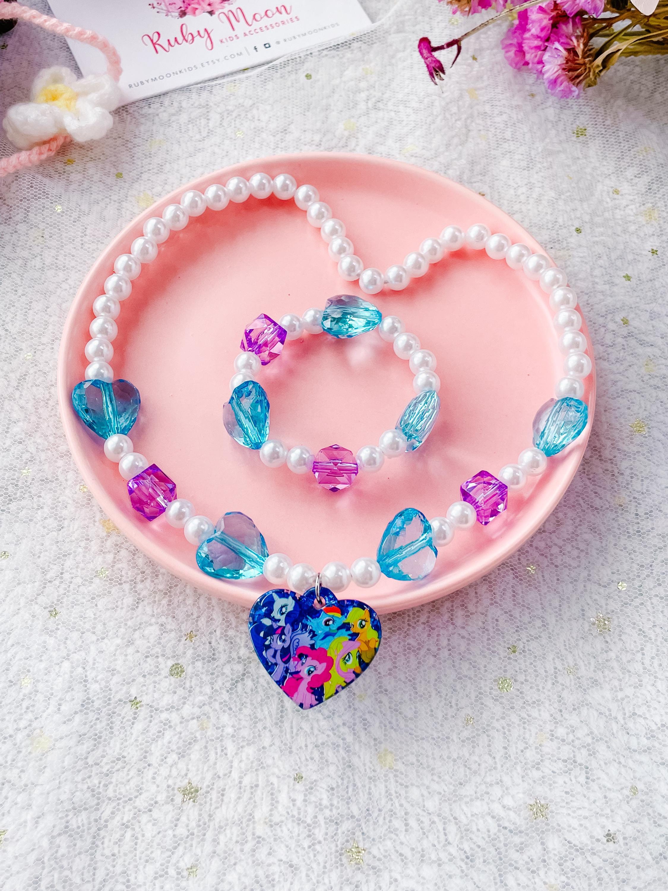 Joy Toy Hasbro 42694 My Little Pony The Movie Parure de bijoux comprenant 1 bracelet de perles, 1 collier de perles, 2 bagues dans un emballage cadeau