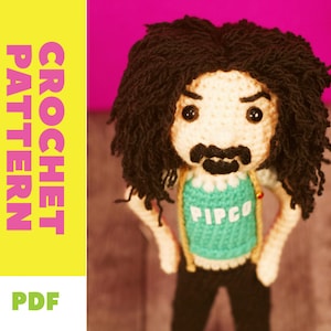 May include: A crocheted doll with a cream-colored face, black hair, and a mustache. The doll wears a teal shirt with the word "PIPCO" and black pants. The image includes the text "CROCHET PATTERN" and "PDF" in a yellow and pink background.