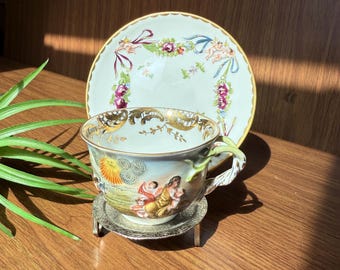 Antique 1800s Capodimonte Cup and Saucer with Whimsical Pastoral Cherib Motif