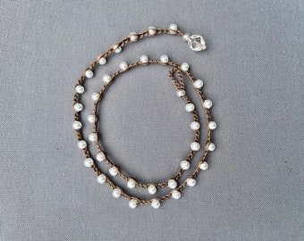 Crocheted beaded necklace with faux pearl beads and sepia cording