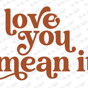 May include: A graphic design with the words "love you mean it" in a warm brown color. The text has a retro, groovy style, with a playful and friendly font. The background is white.