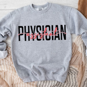 May include: Gray sweatshirt with the text "PHYSICIAN assistant" in black and red lettering.
