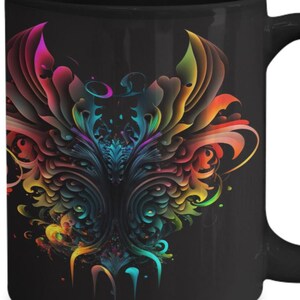 May include: Black ceramic mug with a colourful, abstract design. The design is symmetrical and features a range of colours, including red, orange, yellow, green, blue, and purple. The pattern resembles a stylized floral or ornamental design.