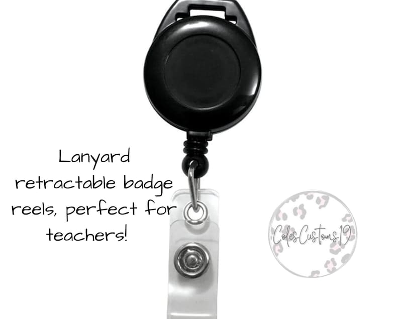 May include: Black retractable badge reel with a clear plastic badge holder. The badge holder has a silver button and a white background with the text "Cole's Customs 19" in black script.