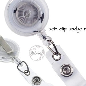 May include: A clear plastic badge reel with a retractable cord and a belt clip. The reel has a silver metal clip and a clear plastic case. The text "belt clip badge reel" is visible in the image.
