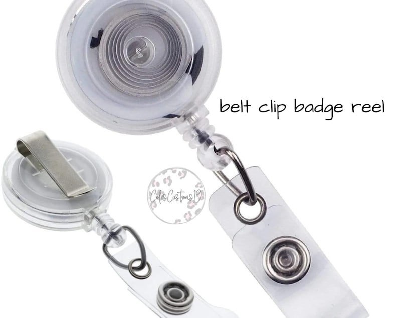 May include: A clear plastic badge reel with a retractable cord and a belt clip. The reel has a silver metal clip and a clear plastic case. The text "belt clip badge reel" is visible in the image.