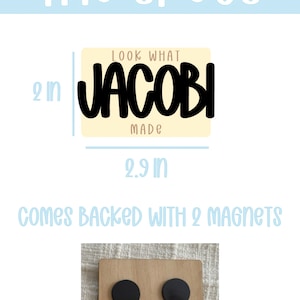 May include: A rectangular magnet with the name "JACOBI" in black, with the text "LOOK WHAT JACOBI MADE". The magnet is 2 inches tall and 2.9 inches wide. The back of the magnet has two black magnets.