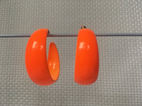 orange colored earrings 1980
