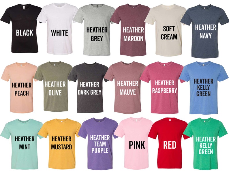 May include: A selection of t-shirts in various colors, including black, white, heather grey, heather maroon, soft cream, heather navy, heather peach, heather olive, heather dark grey, heather mauve, heather raspberry, heather kelly green, heather mint, heather mustard, heather team purple, pink, red, and heather kelly green. The shirts are all short-sleeved and have a crew neck.
