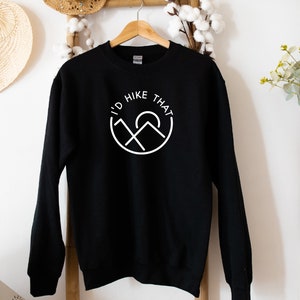 May include: Black sweatshirt with a white graphic that says "I'd Hike That" with a mountain and sun design.