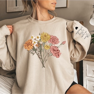 Sweat-shirt personnalisé bouquet de fleurs sauvages pour le mois de naissance, cadeau personnalisé pour maman, cadeau jardin pour grand-mère, cadeau fête des mères, nom d'enfant imprimé sur les manches MO37