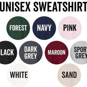 May include: A selection of unisex sweatshirt colors, including forest green, navy blue, pink, black, dark grey, maroon, sport grey, white, and sand.