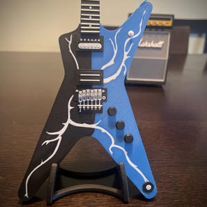 Dimebag Darrell fans!  1:4 scale mini replica of the Dimebolt Dean ML guitar!