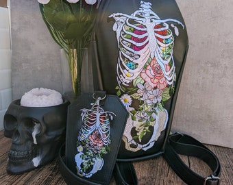 Floral rib coffin backpack with  zipper front slip pocket. Ready to ship! Vegan leather. Full embroidery. convertible to crossbody