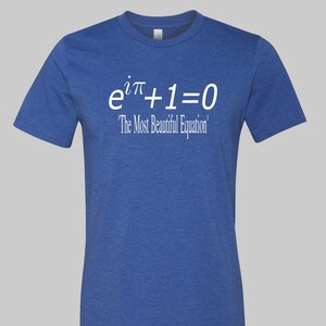 May include: A blue crew neck t-shirt with white text. The text displays the mathematical equation "e^iπ+1=0" and the phrase "The Most Beautiful Equation". The shirt is made of a soft material.