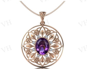 May include: A rose gold pendant necklace with a large oval amethyst gemstone surrounded by smaller diamonds. The pendant is set in a delicate filigree design.
