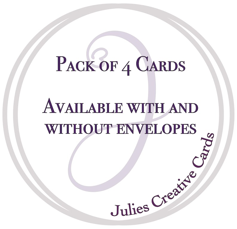 May include: A circular graphic with text that reads "Pack of 4 Cards" and "Available with and without envelopes." The text is in a dark purple color, and the graphic has a light purple swirl design and the words "Julies Creative Cards" in a circular font.