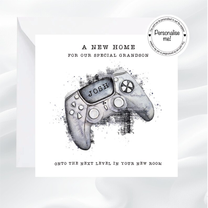 May include: A white greeting card with the text "A NEW HOME FOR OUR SPECIAL GRANDSON" and "ONTO THE NEXT LEVEL IN YOUR NEW ROOM". The card features a watercolor-style image of a gray video game controller with the name "JOSH" on it.