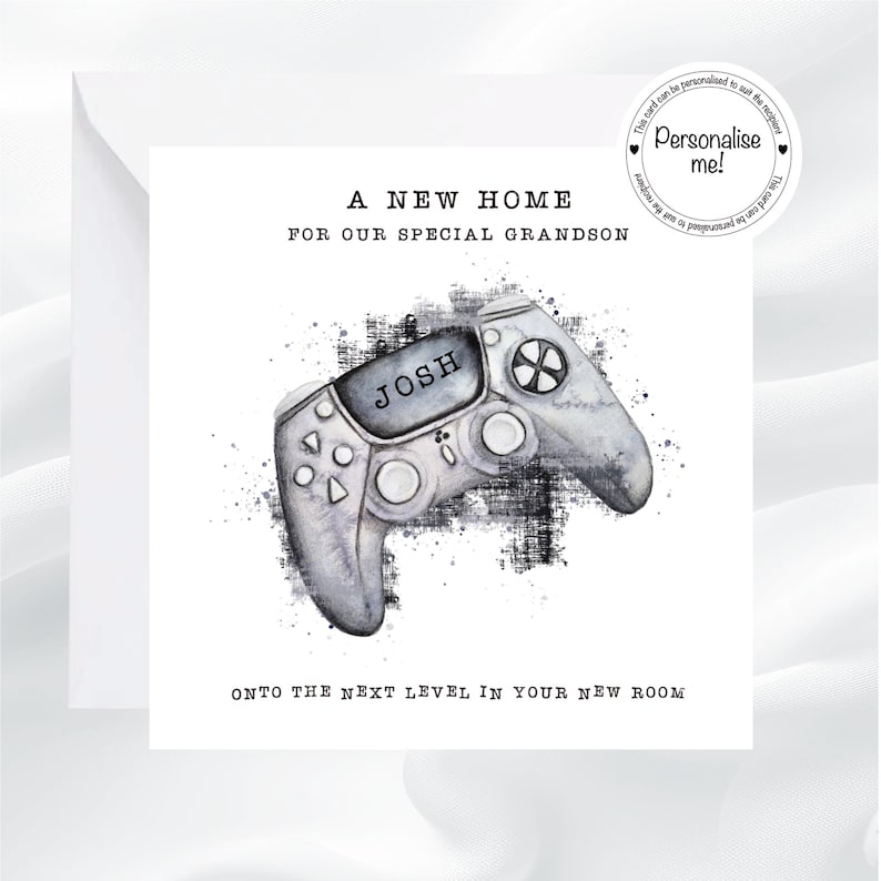 May include: A white greeting card with the text "A New Home For Our Special Grandson" and "Onto the Next Level in Your New Room". The card features a watercolor-style image of a gray video game controller with the name "Josh" on it.