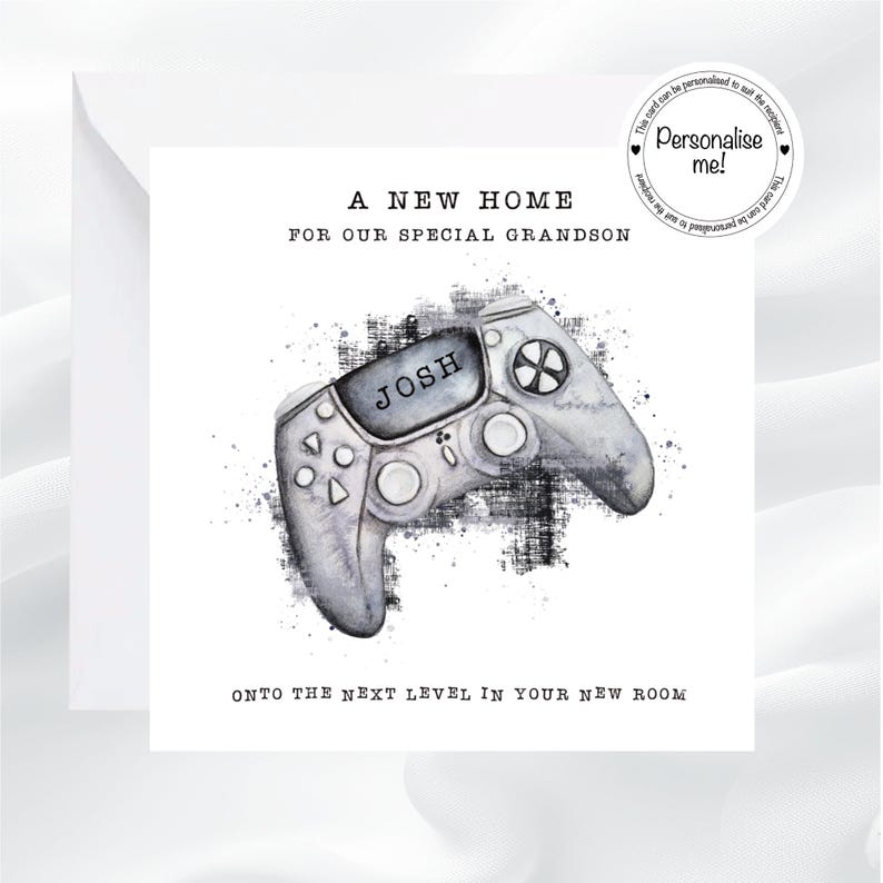 May include: A white greeting card with the text "A NEW HOME FOR OUR SPECIAL GRANDSON" and "ONTO THE NEXT LEVEL IN YOUR NEW ROOM". The card features a watercolor-style image of a gray video game controller with the name "JOSH" on it.