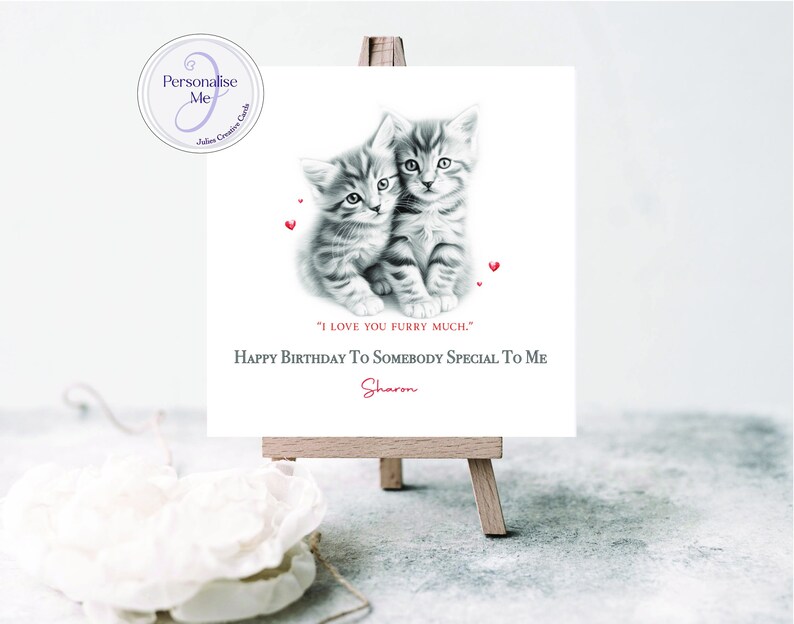 May include: A birthday card featuring a black and white illustration of two kittens cuddling. The card has a red heart design and the text "I love you furry much." and "Happy Birthday to somebody special to me".