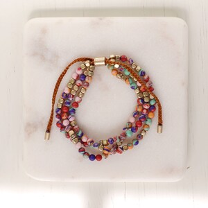 3strand blue stone delicate beaded pulltie bracelet. sophisticated gemstone gold beads bracelet.Boho Hippie surfer layering beads bracelet