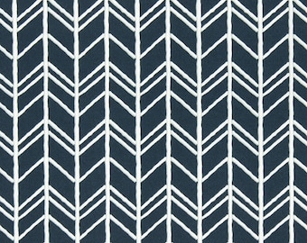 May include: White chevron pattern on a dark blue fabric. The fabric is measured with a ruler in inches.