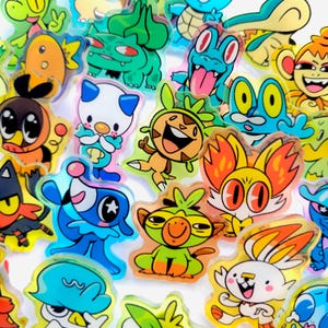 Pocket Monsters PKMN Acrylic Pins: Charmander, Bulbasaur, Squirtle, Totodile, Cyndaquil, Rowlet, Pombom, Browt, Piplup, Oshawott,Fuecoco etc