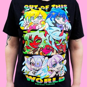 May include: Black t-shirt featuring a colorful anime-style graphic with the text "OUT OF THIS WORLD" and the artist's name, Raluca Farcas. The graphic includes multiple cartoon characters with vibrant hair and expressions.