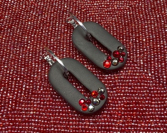 Black hoops with black and red rhinestones on silver lever back tops