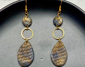 Modern dangle earrings in embossed hematite and gold with brass accents and French hooks