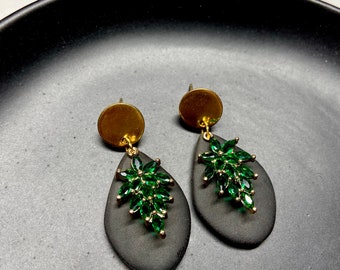 Holiday black dangles with gold studs and green rhinestones