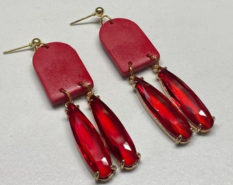 Red crystal dangle earrings with gold ball tops