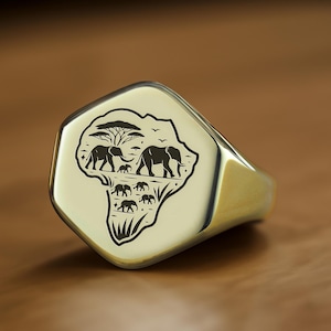 Anillo con sello de mapa africano en oro de 14 k · Anillo con elefante africano · Anillo con forma hexagonal · Anillo Heritage en oro de 14 k