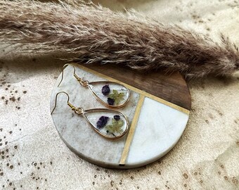 A pair of handmade Clear Resin Dangle Drop Earrings with Pressed Flowers,