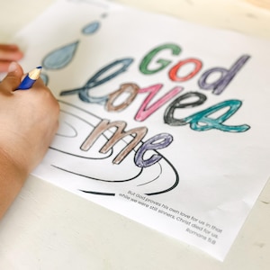 May include: A coloring page with the words "God loved me" in colorful letters. The page includes a quote from Romans 5:8, "But God proves his own love for us in that while we were still sinners, Christ died for us."